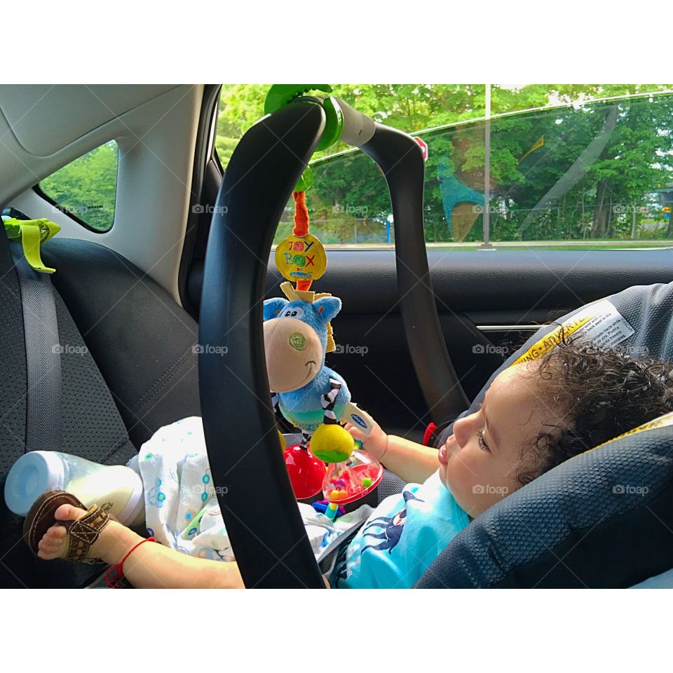 Outdoor. Parking lot in chase , playing with toys while I wait 