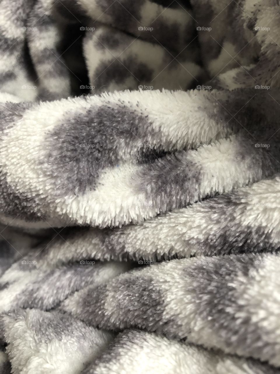 This comfortable, fluffy blanket has been bunched up to create an interesting pattern.