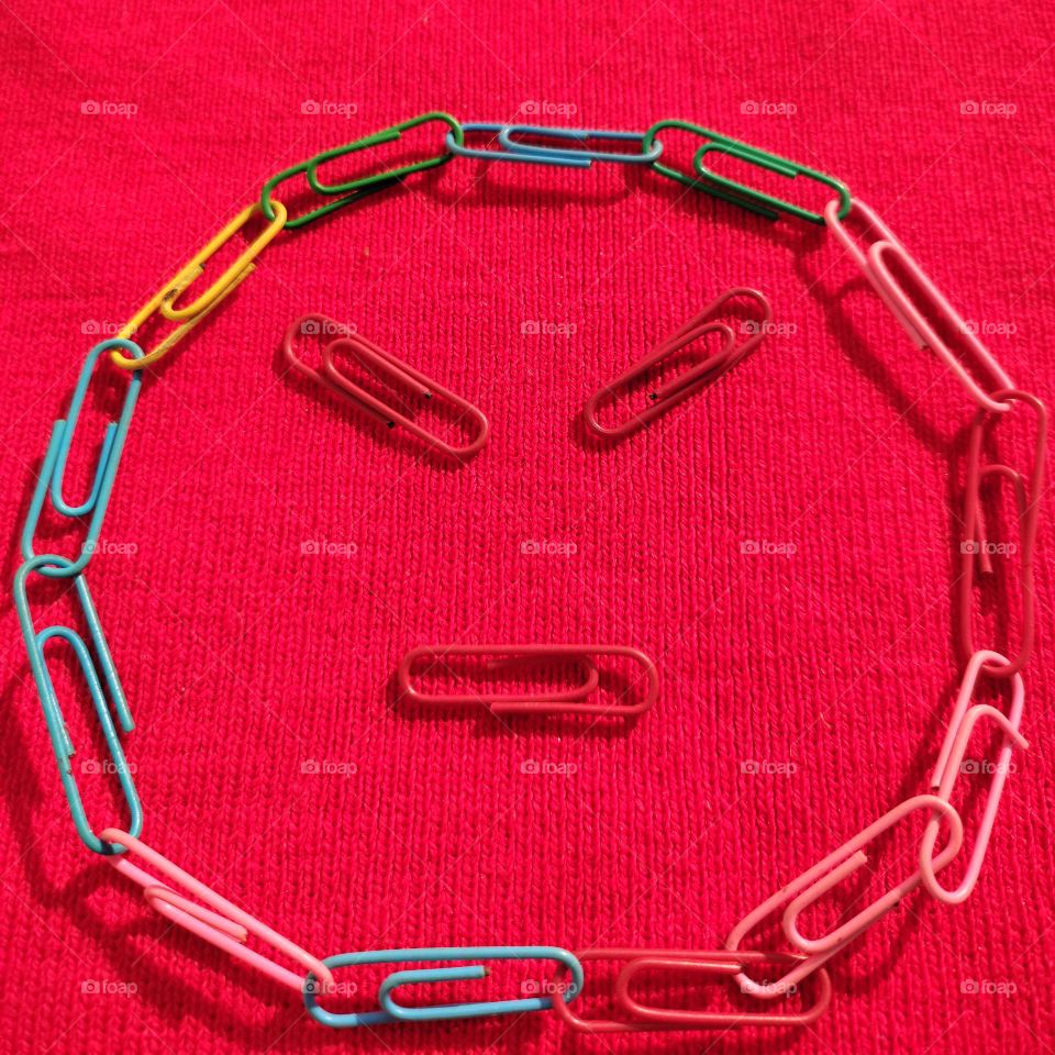 angry face made of paper pins