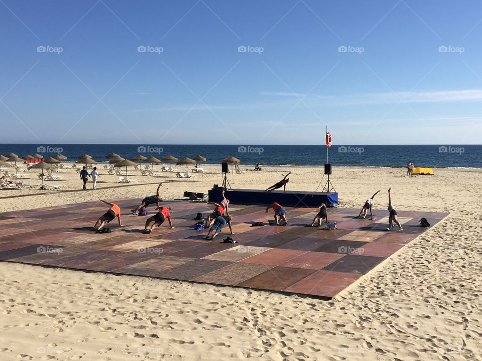 Yoga training on the beach
