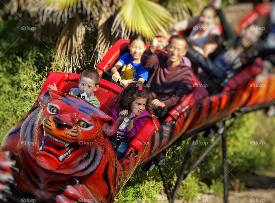 Kids Riding A Rollercoaster