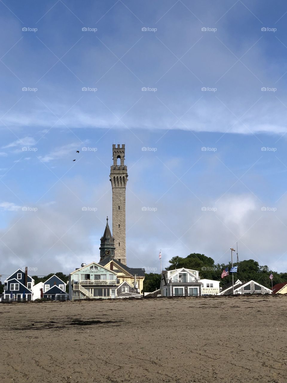 The Pilgrim Monument as seen from a beach in Provincetown on a summer day