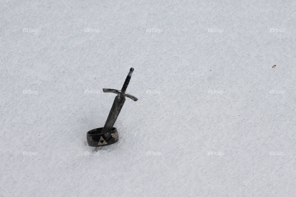 Sword in ring on snow