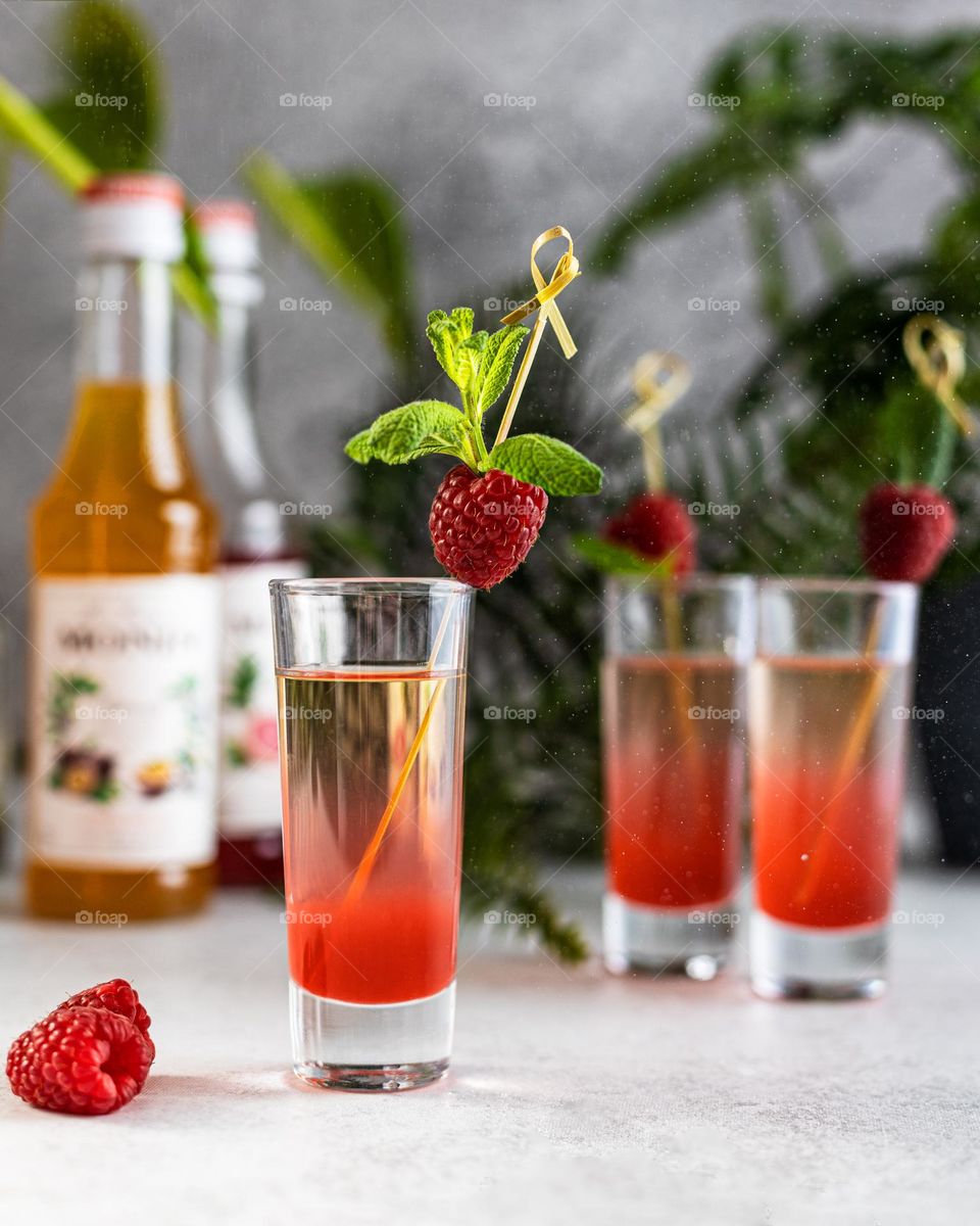 Shots decorated with mint and raspberry 