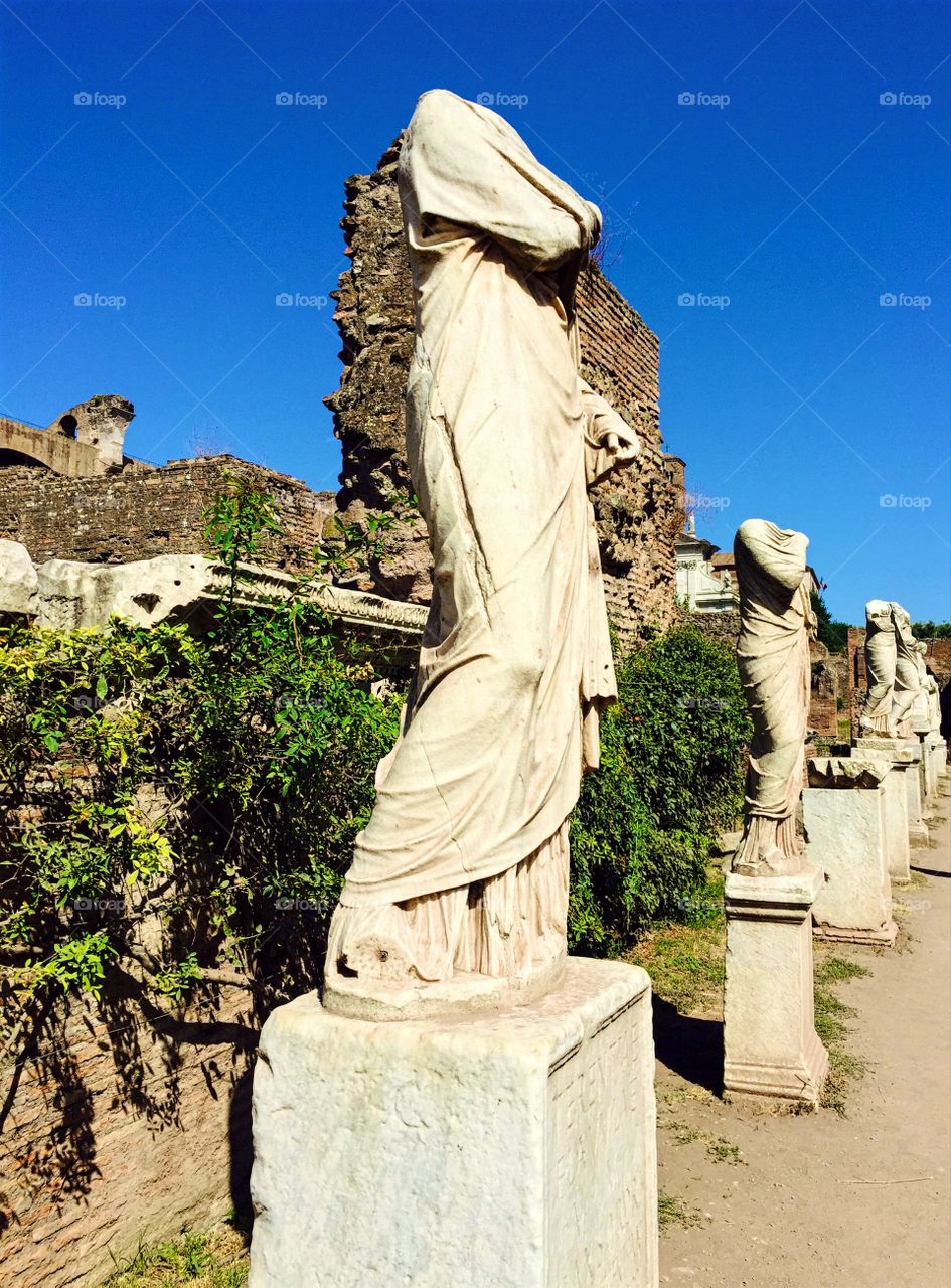 Statues in the emperors garden. Foro Romano, Rome, italy. 
A place few knows exists. 
Marble statues in one of the gardens.