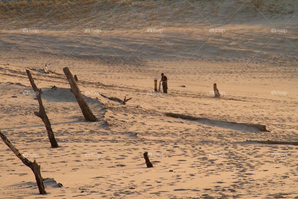sand boarding. boarding down the dune