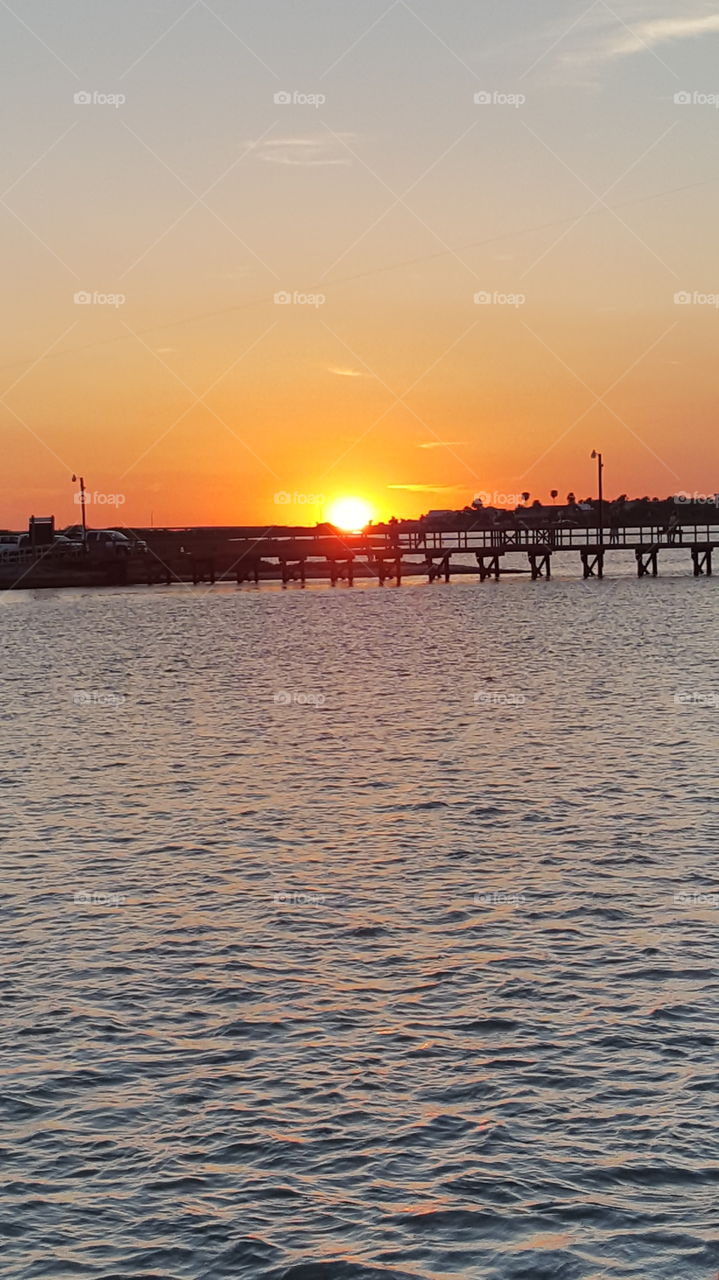 Sun setting over the pier