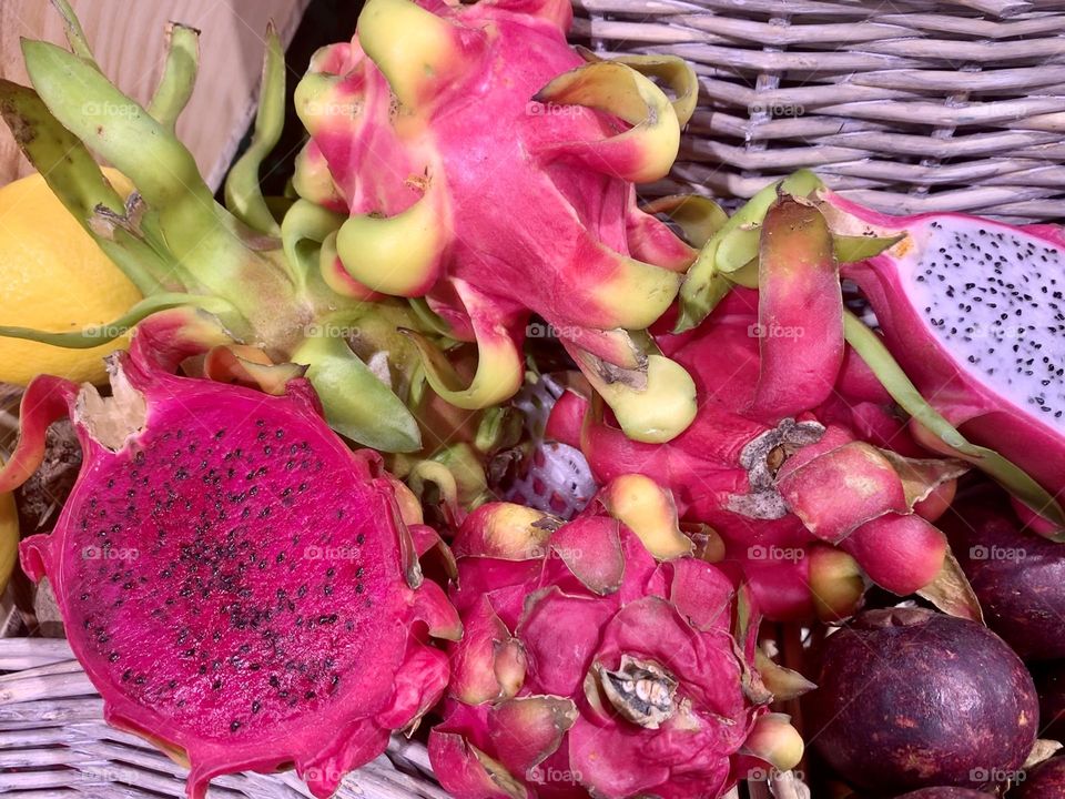 Magenta dragon fruit, pitaya, strawberry pear tropical fruit inside nest 