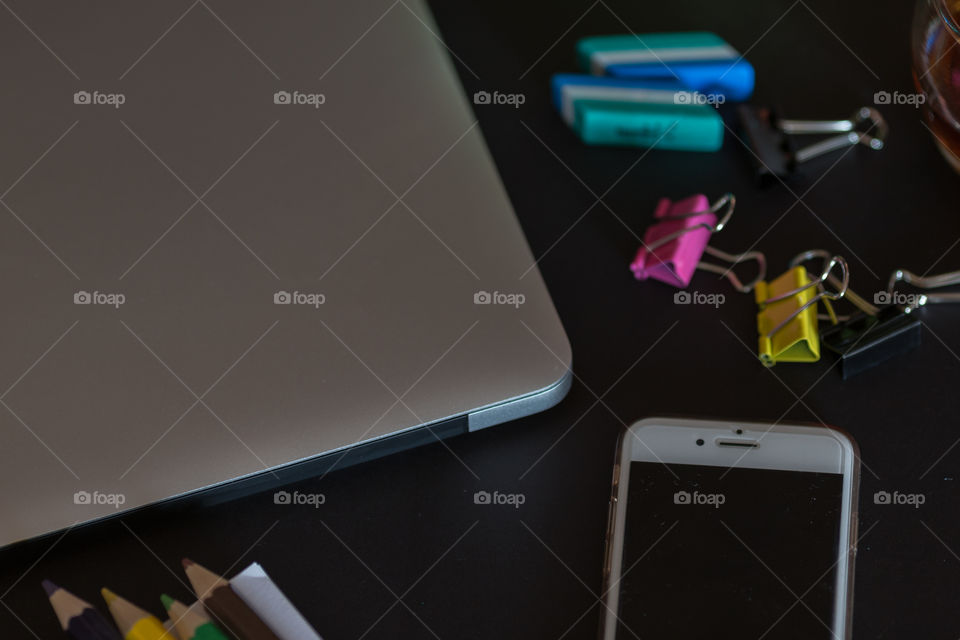 laptop and phone on the desk