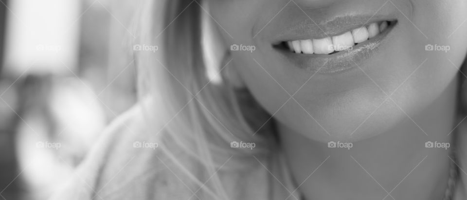 pretty woman smiling with beautiful white teeth and rose lipstick