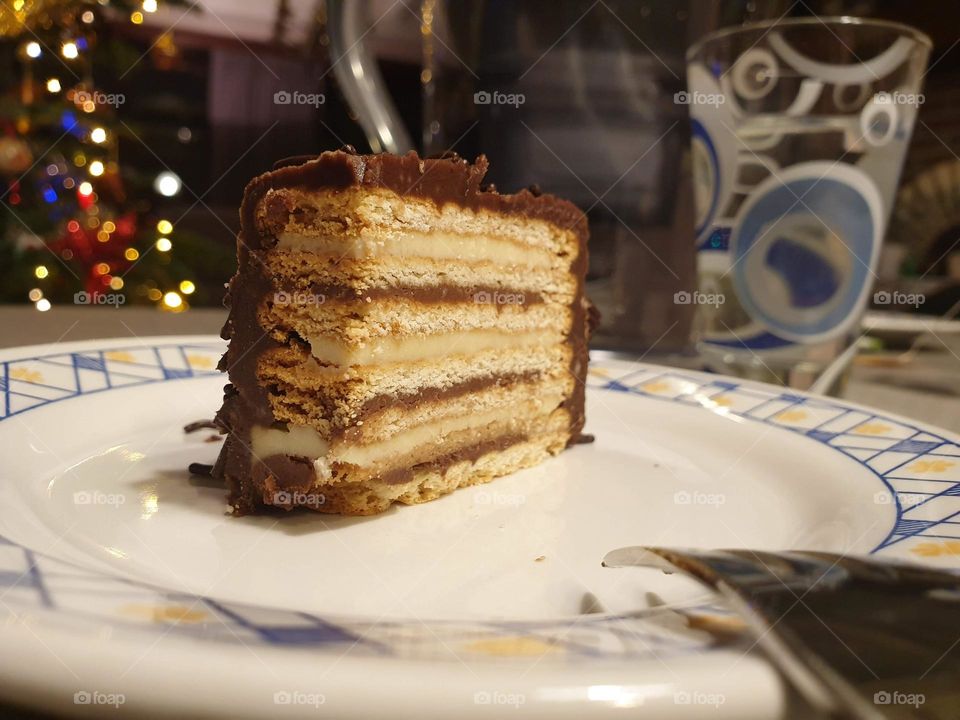 a portrait of a chocolat cake with different layers inside of the unhealthy dessert.