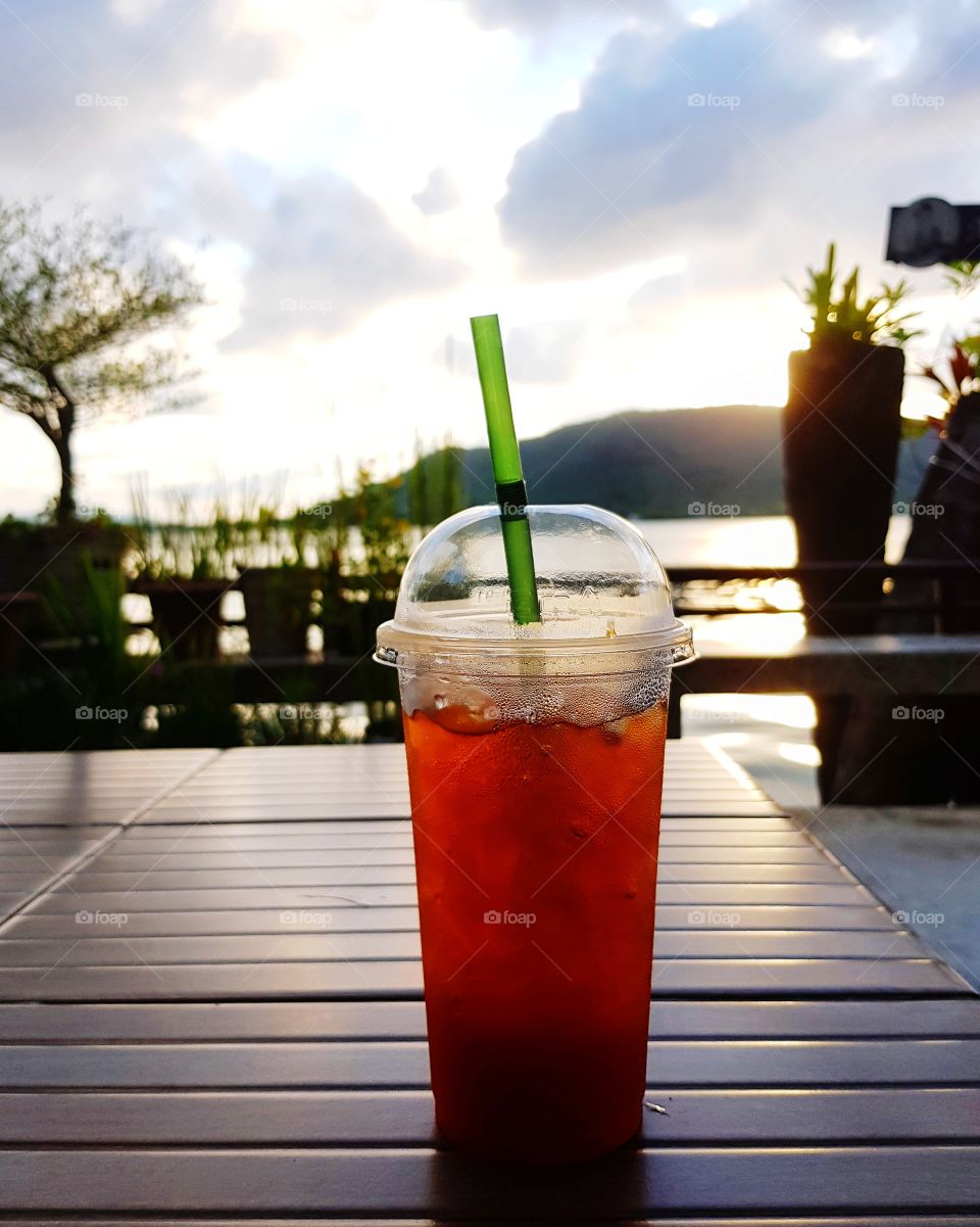 Ice lemon tea glass on nature background