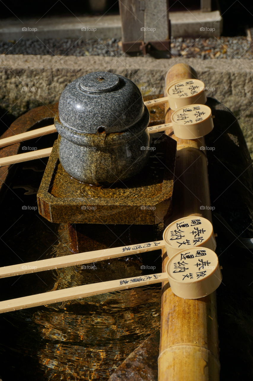 Stone and bamboo drinking trough