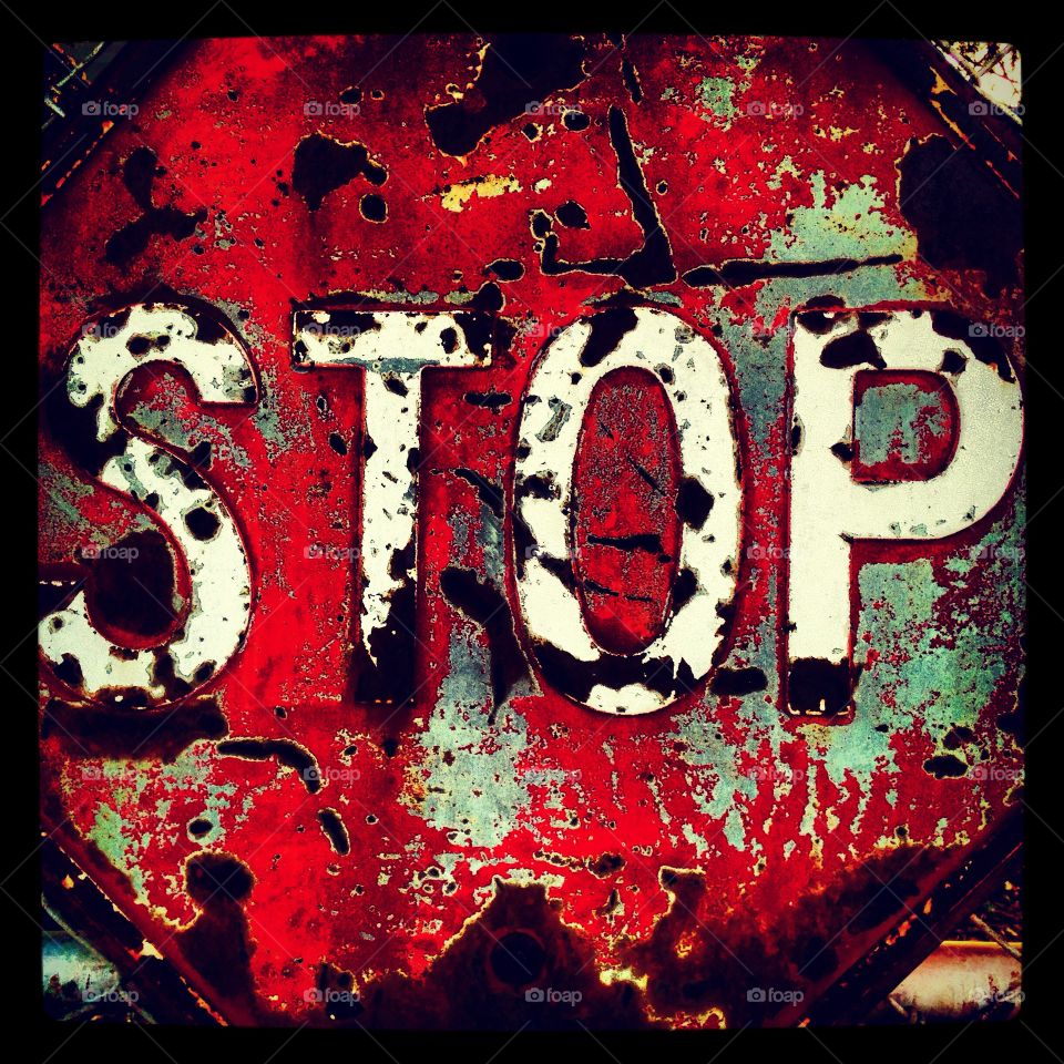 Beat up stop sign 