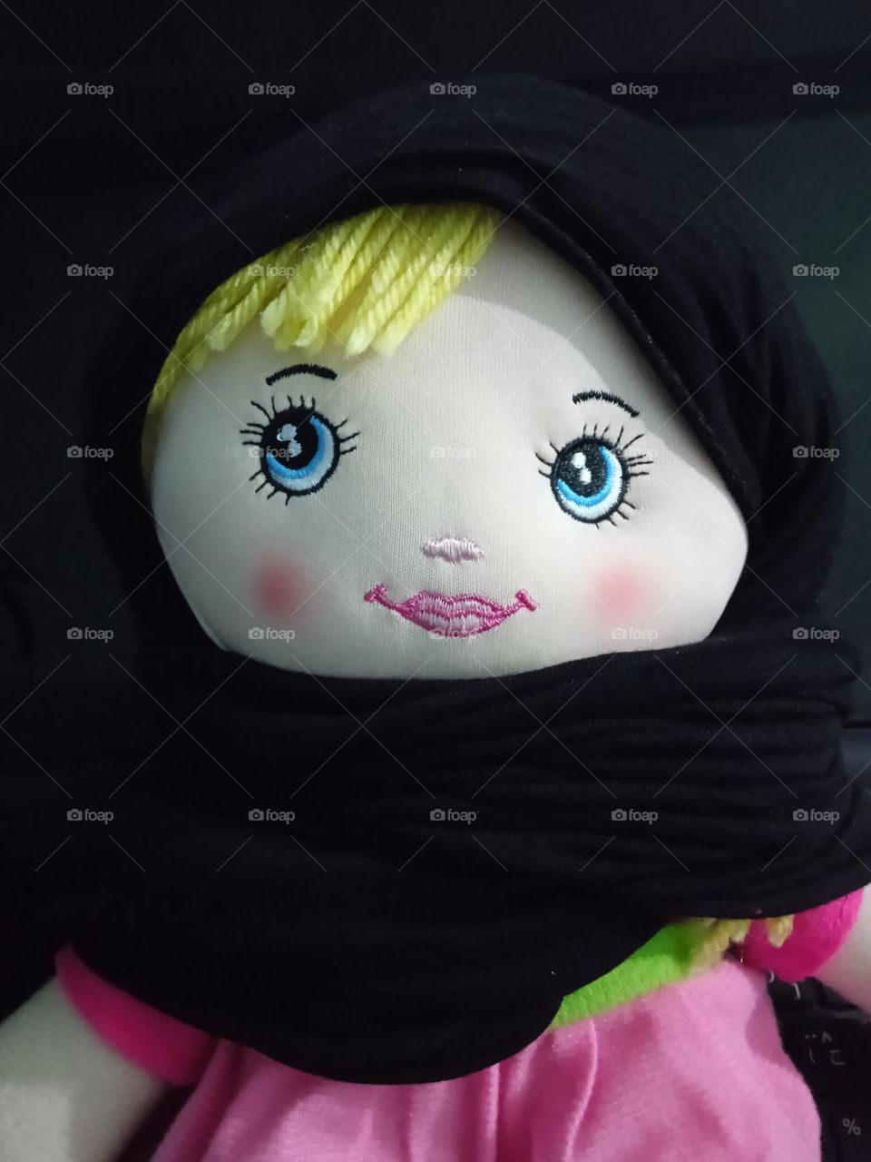 A pretty doll yellow hair with hijab