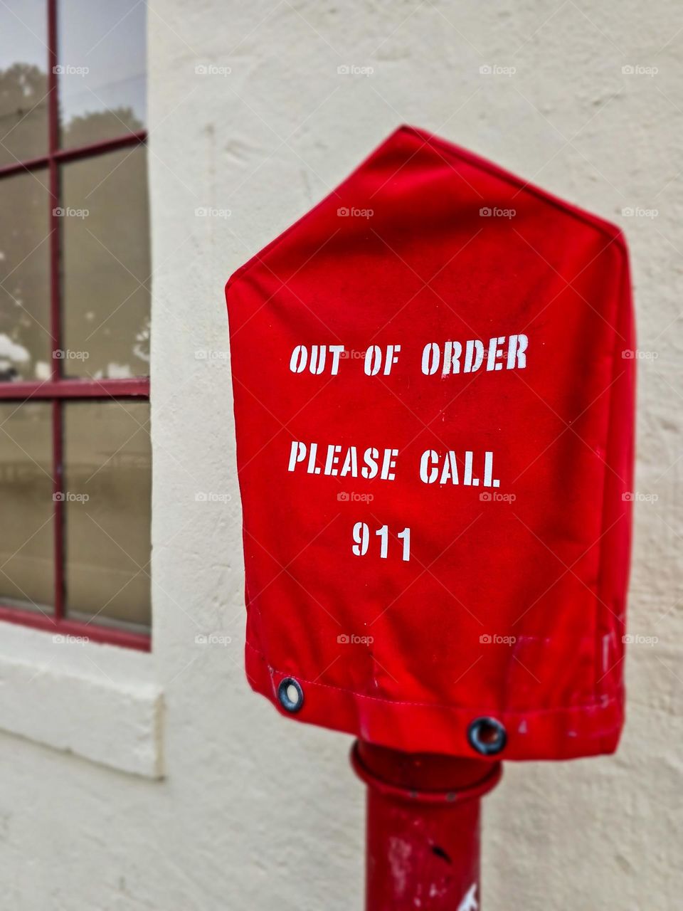 Out of order please call 911 sack put over an old public emergency pull in San Francisco California 