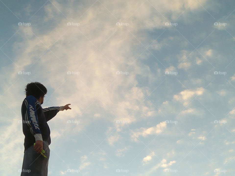 Standing man looking at the sky.