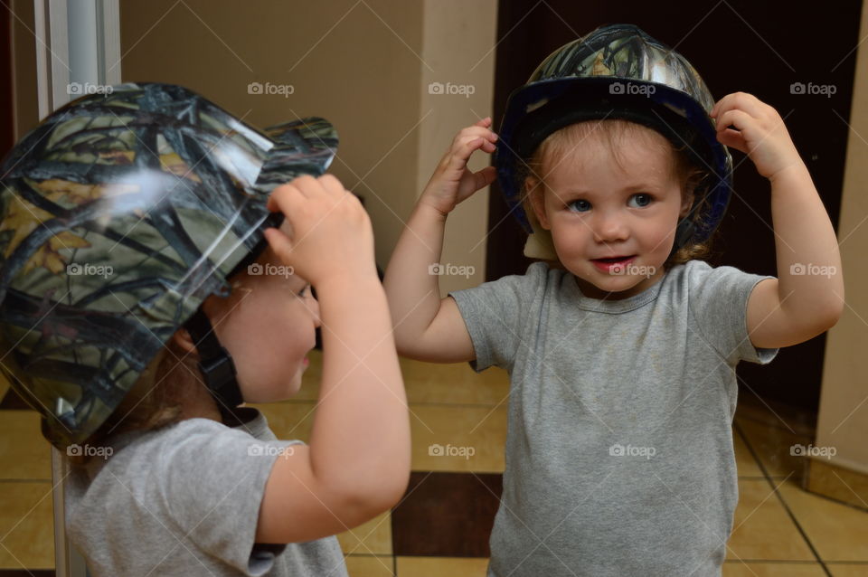 Child in unique helmet