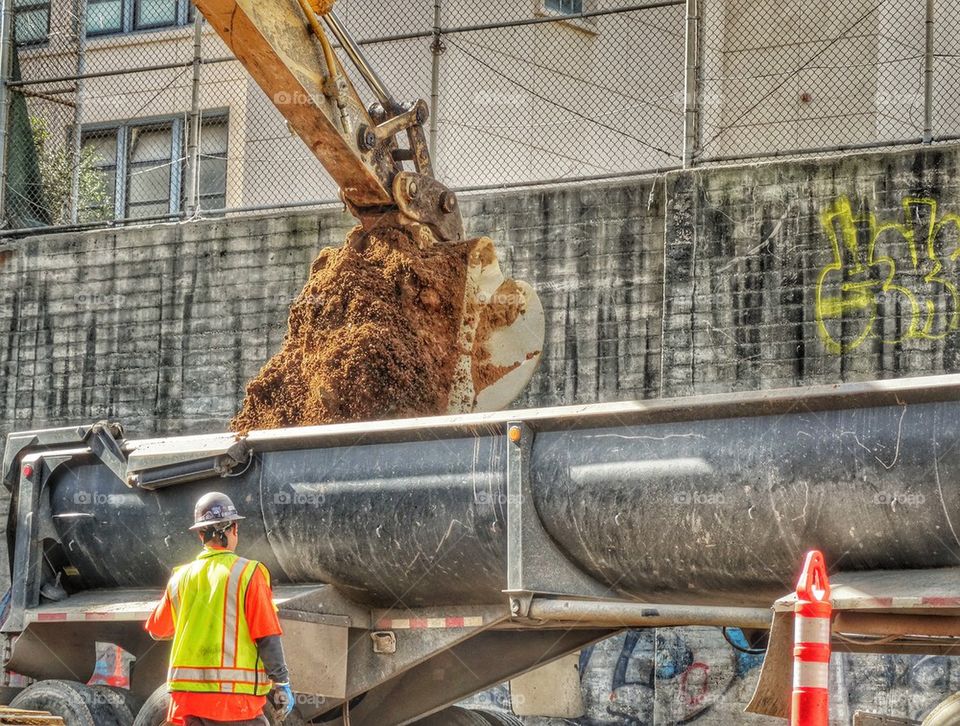 Heavy Machinery Clearing A Building Site. Construction Work In The City
