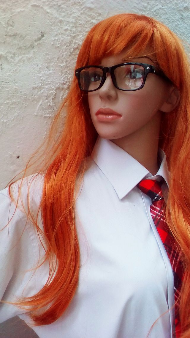 Pretty young women mannequin with
red long hair
