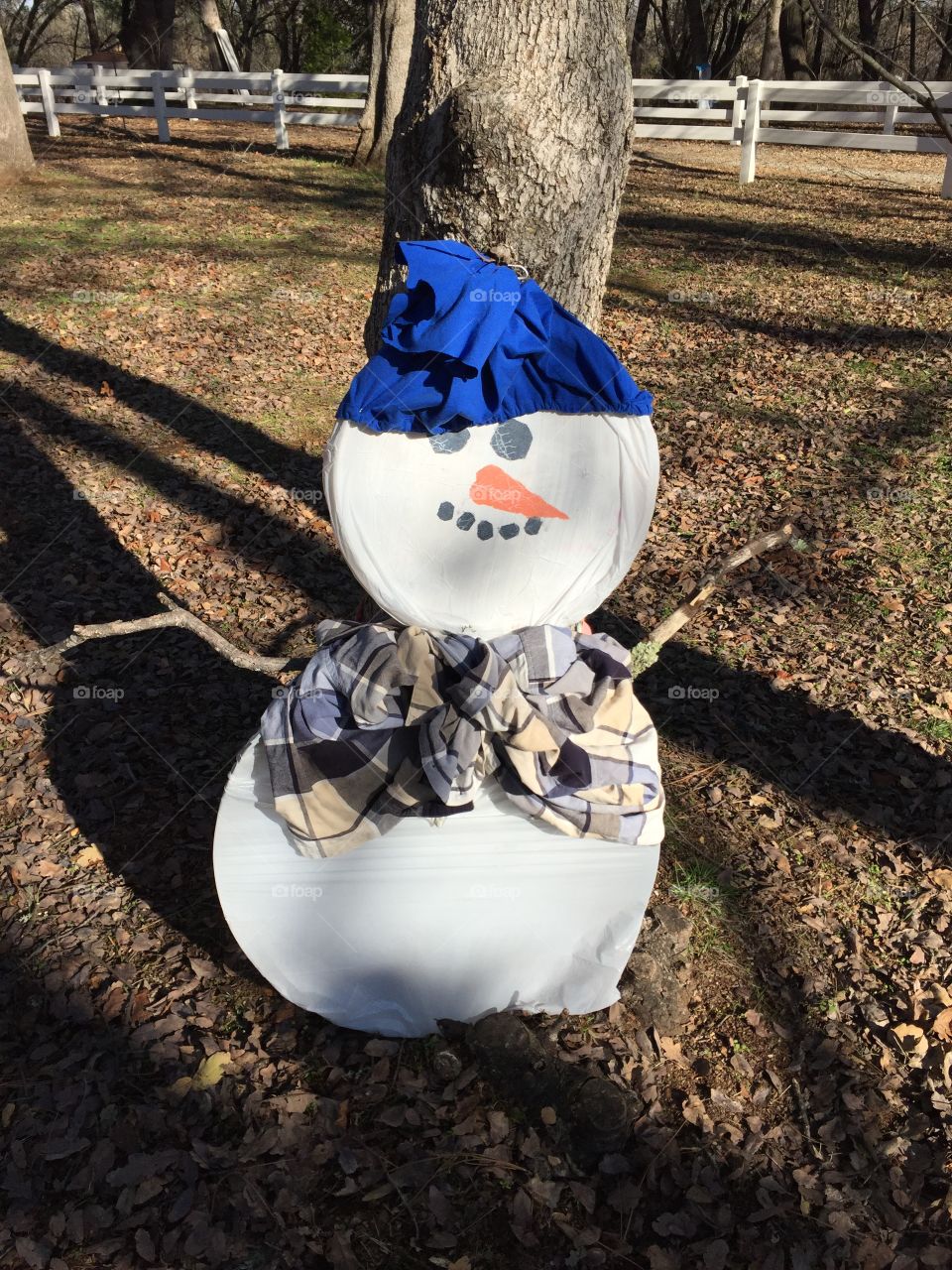 Chilling in the leaves - wishing for some snow!
Let's see.... 
white plastic trash bags✔️
 old colourful clothing ✔️
Black,white & orange paint✔️
Plastic lids from store bought pizzas or fruit trays✔️
Imagination✔️



