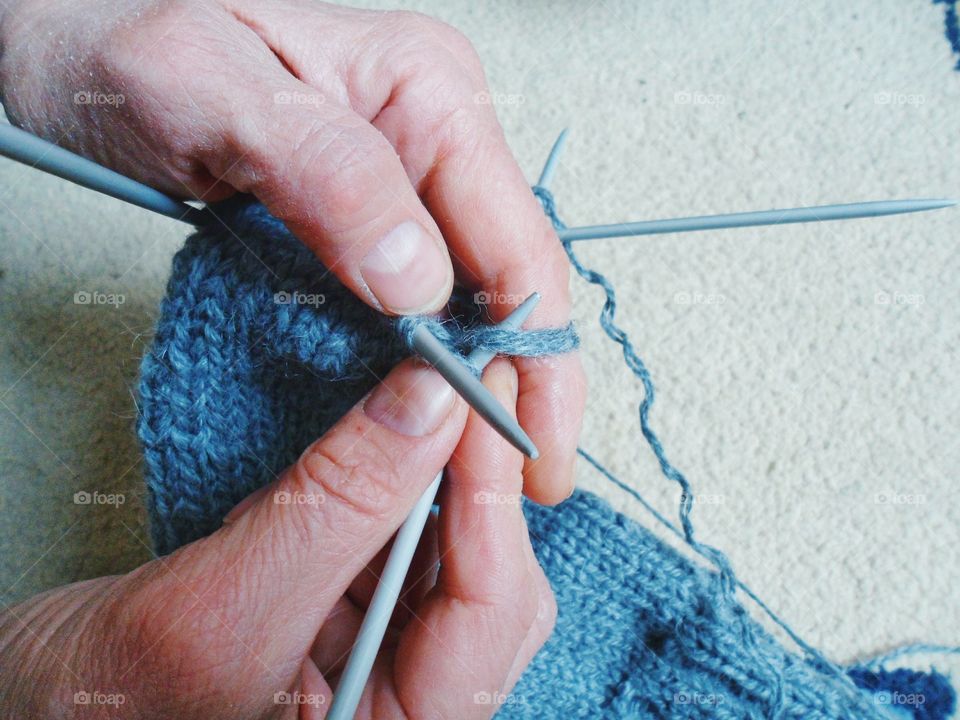 Close-up of hand knitting wooly socks