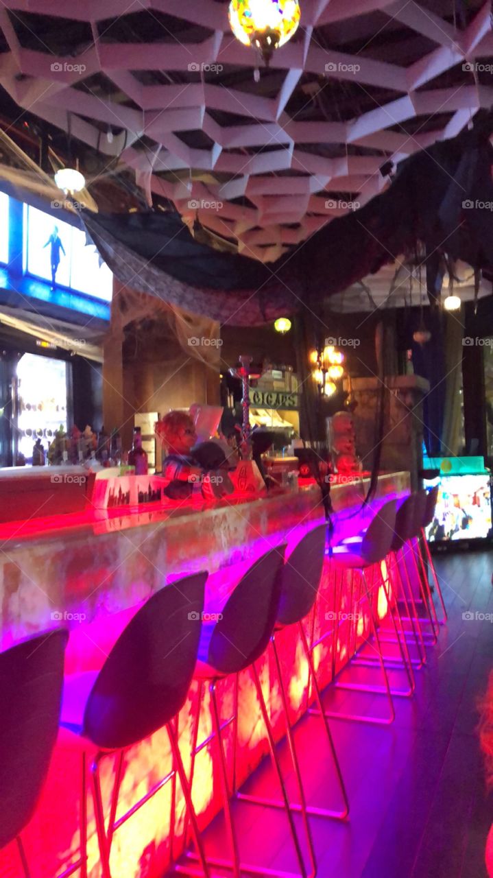Awesome looking bar lit up with pinkish purple litchi looks impressive 