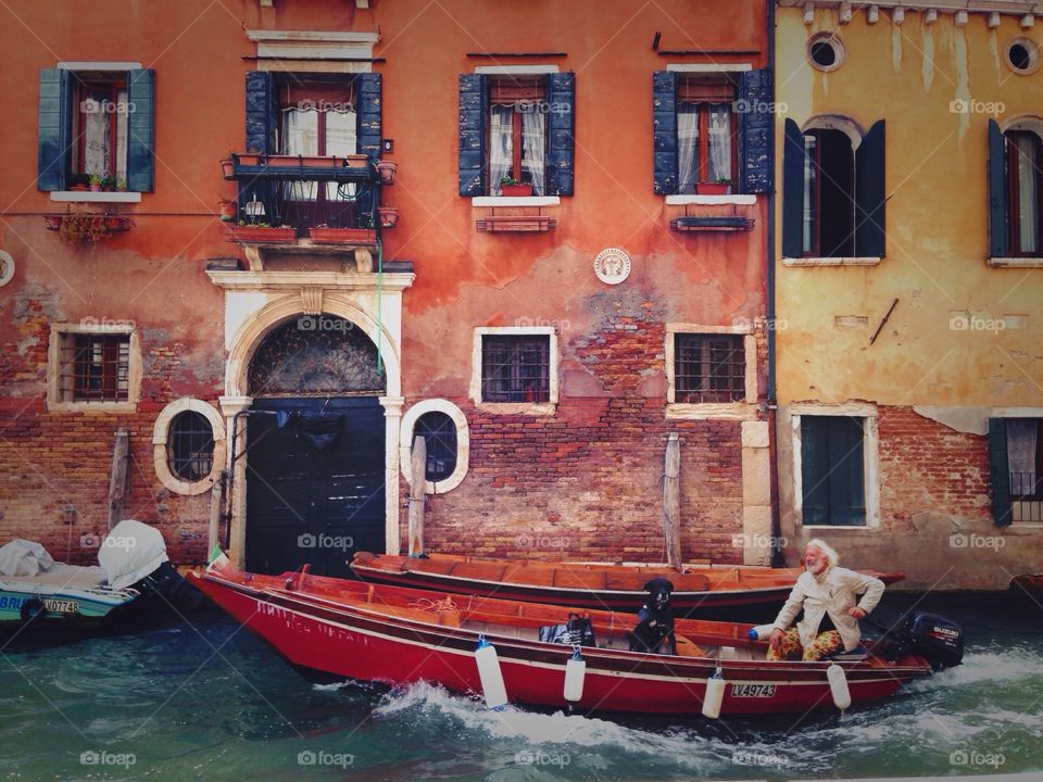 Man with dog in gondola, Venice