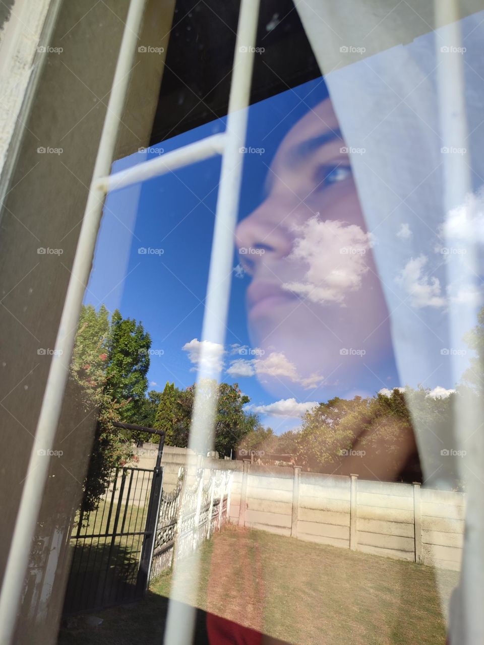 Young male looking out of the window