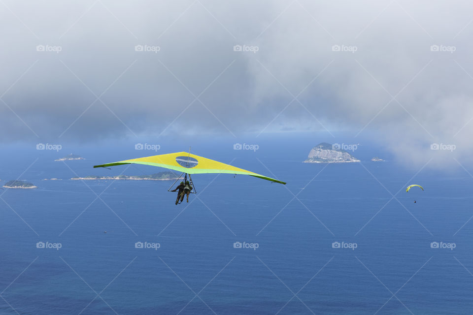 Hang gliding flying over in Rio de Janeiro Brazil.