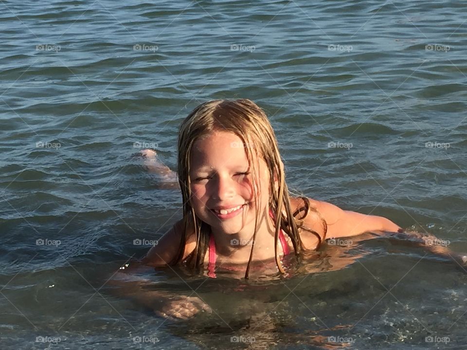 Little girl in the ocean 