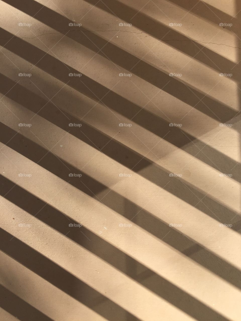 Sunlight on my balcony. Sunlight filtering through the rails in my balcony. 