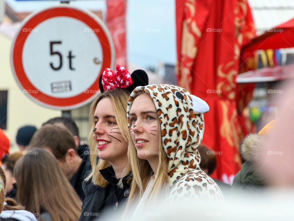 Portrait of girls wering car and mouse coustumes at carnival