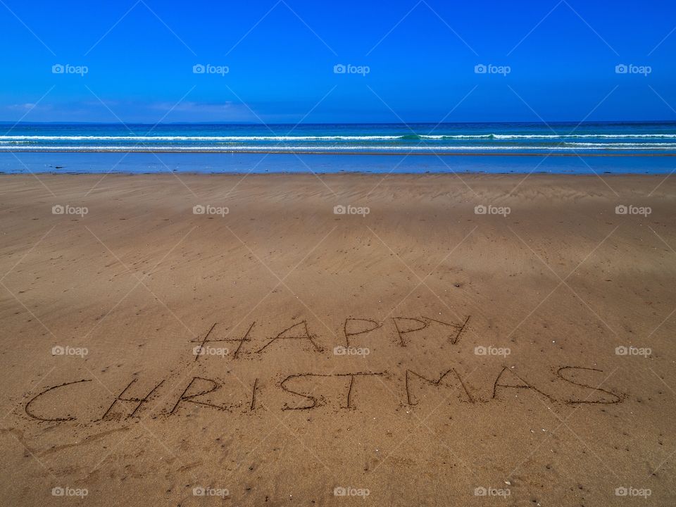 Happy christmas, beach writing 