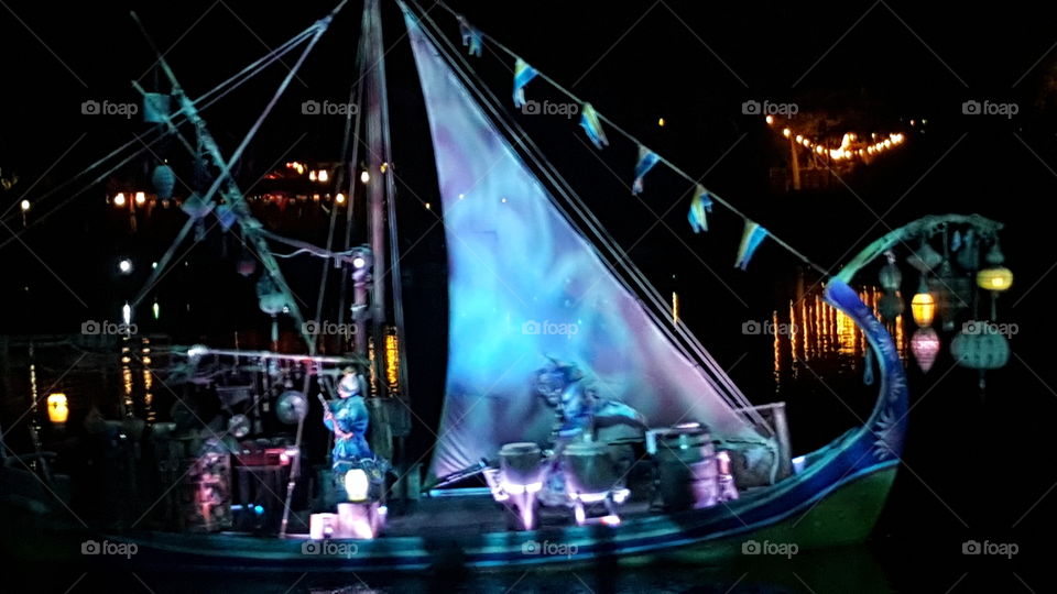 A brilliantly illuminated ship makes its way to the waters of Discovery River during Rivers of Light at Animal Kingdom at the Walt Disney World Resort in Orlando, Florida.