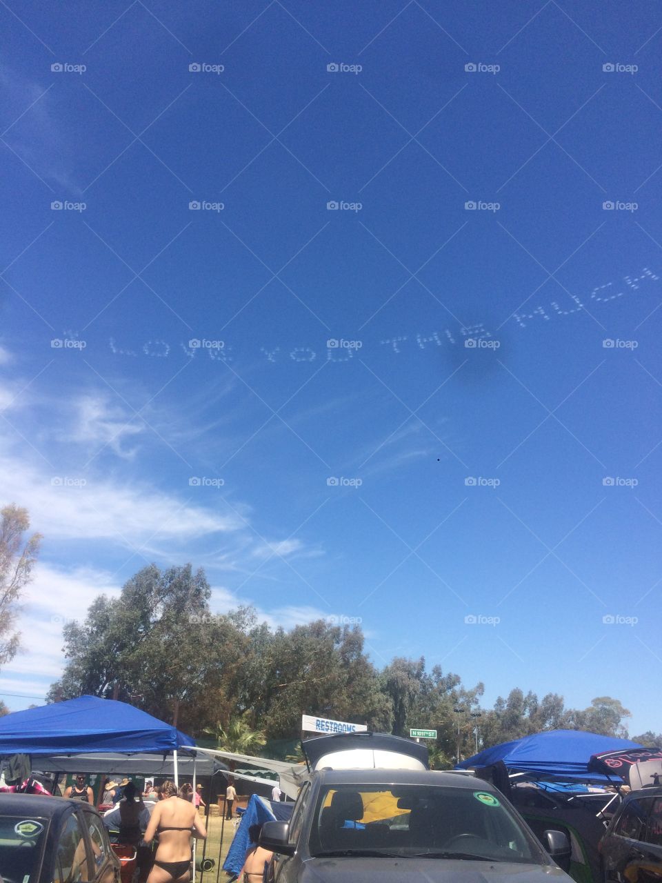 “I love you this much” written by a plane over the Coachella music festival 