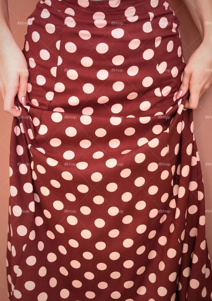 Polka dot skirt /polka dot world /maroon colour polka dot skirt on a woman /hands holding skirts/red clothing /vintage clothing