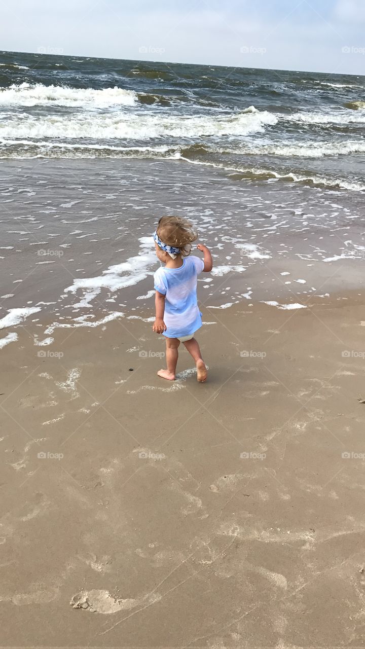 Baby and cold sea