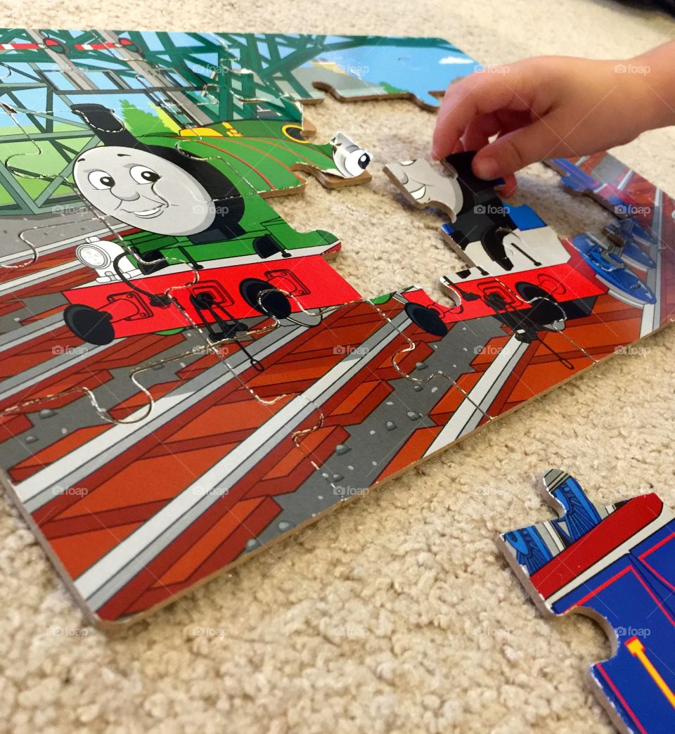 Puzzles are challenging for the little minds. 