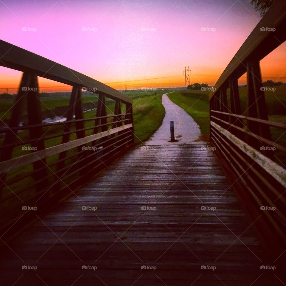 Path to wonderland. Biking in the prairie sunset.