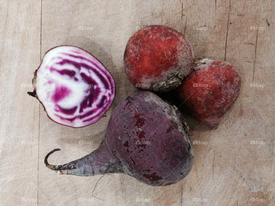 Beets on old wooden cutting board