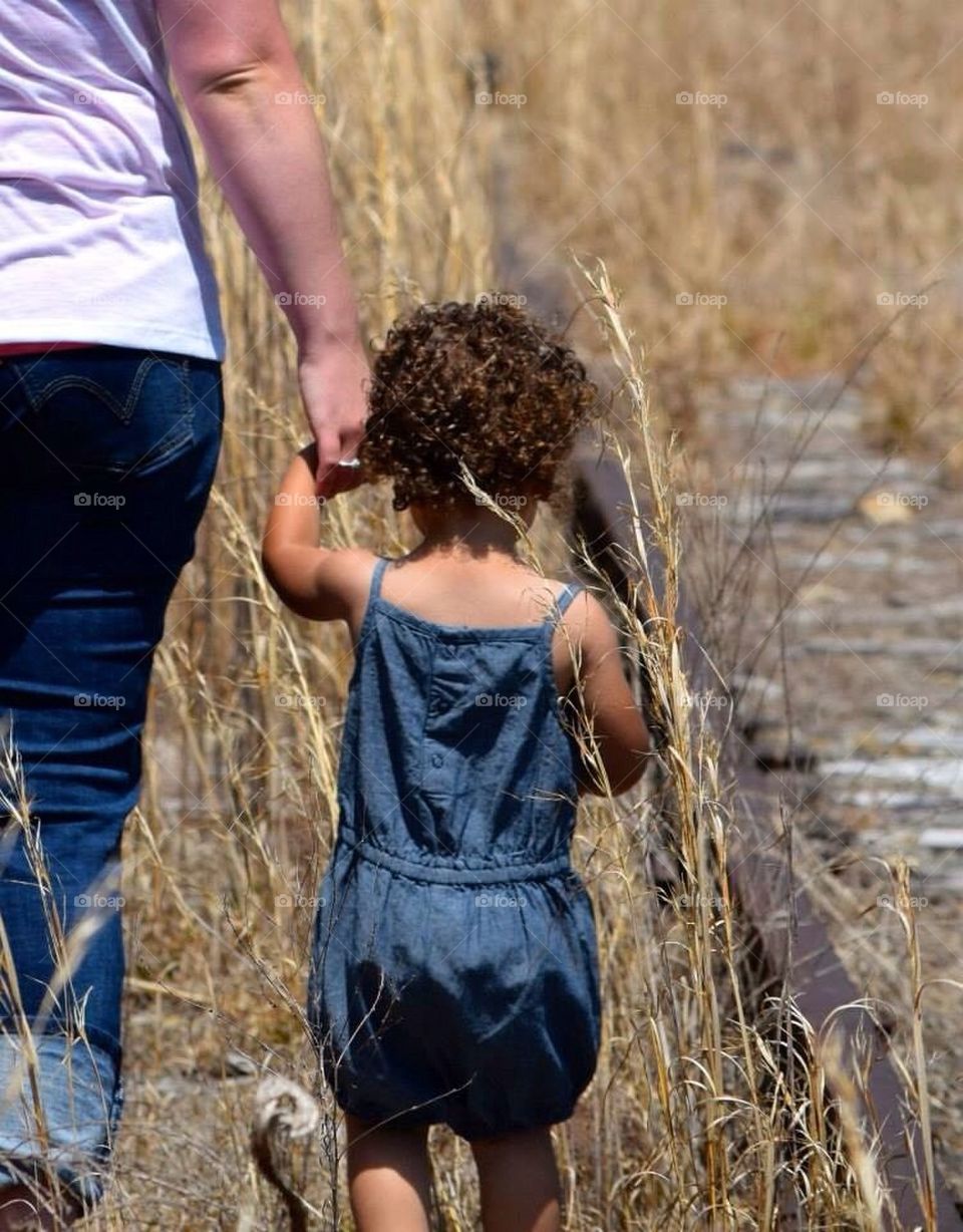 Little girl holding hands