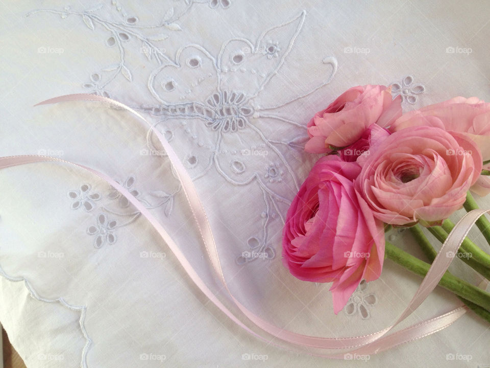 Pink flowers on decorative fabric