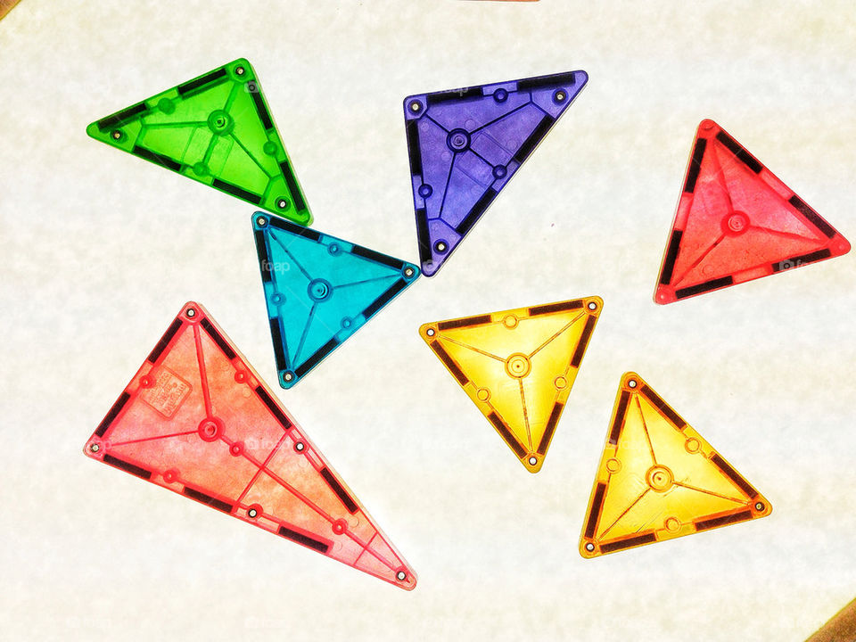 Bright colored triangular magnetic tiles inspire early childhood