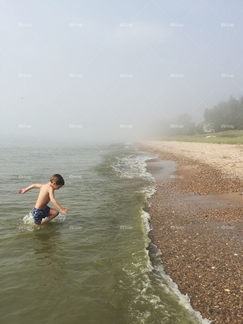 Boy running in sea