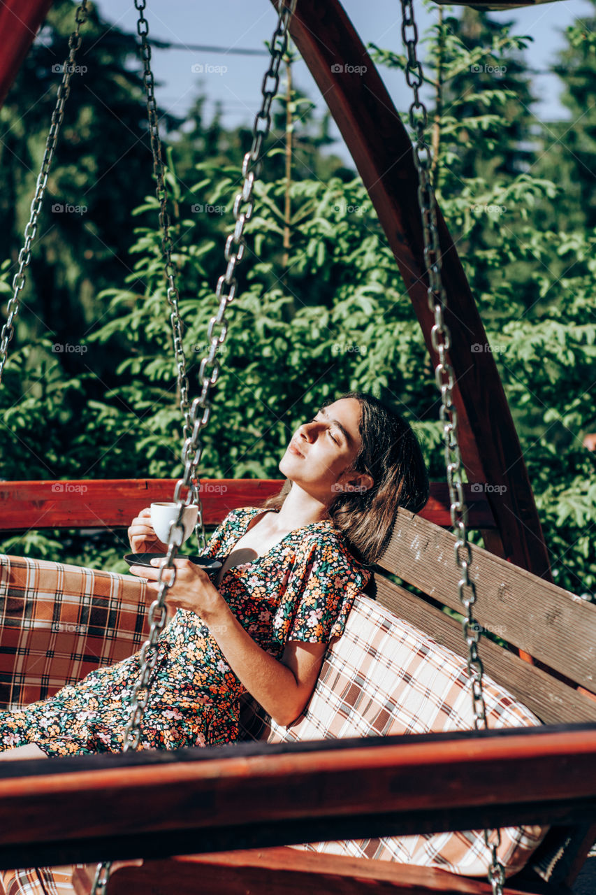 woman enjoying a cup of coffee