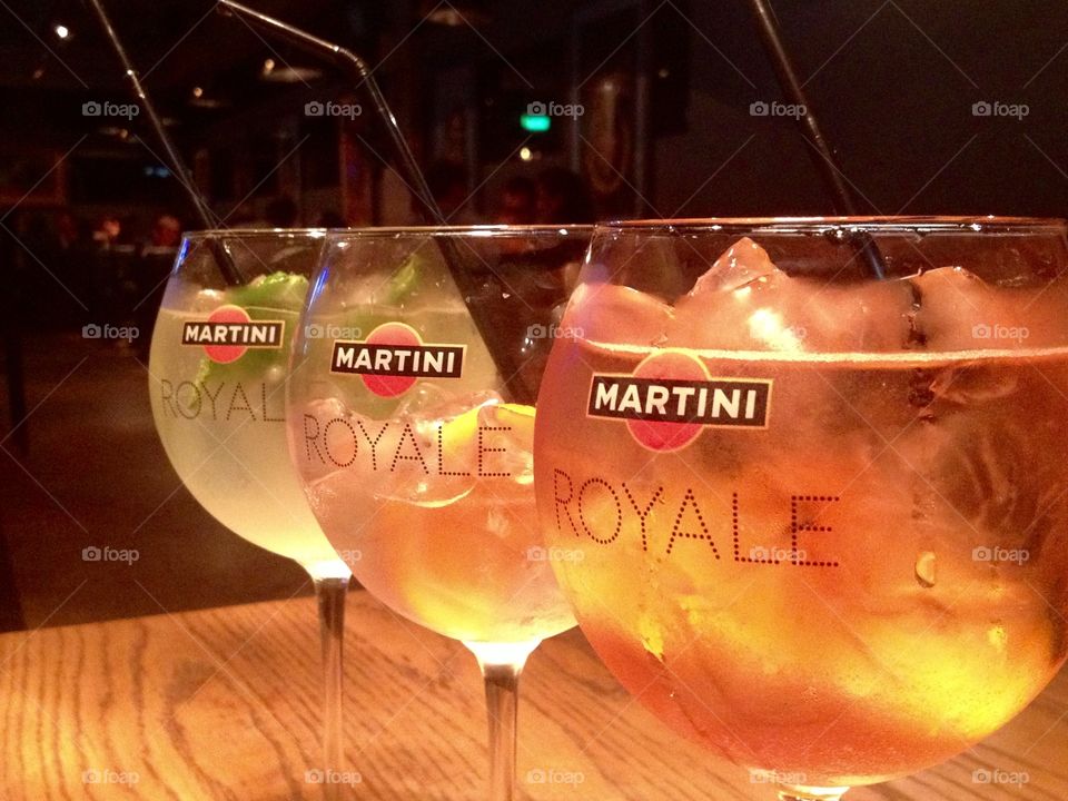 Three cocktails Martini Royal in the bar