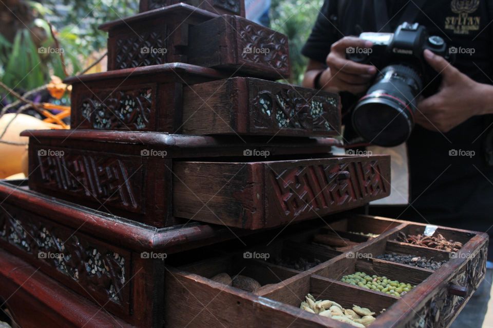 photo shoot of typical Indonesian spice storage items.