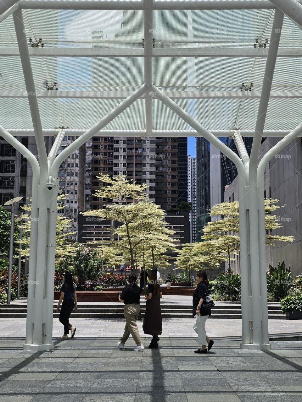 Summer in the city, people passing this pathway