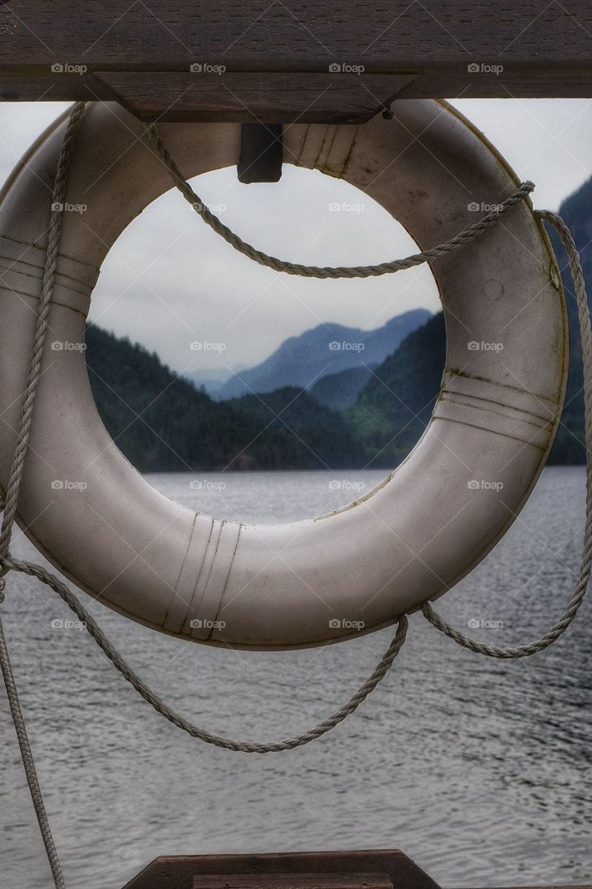 Mountain Scene. Mountains framed through a life ring